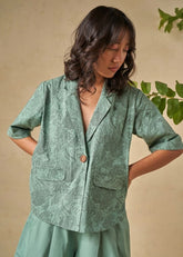 A Model Wearing Green Organic Cotton The Coral organic cotton shacket, curated by Only Ethikal